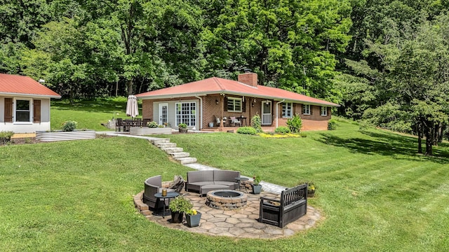 330 Cascade Hollow Rd, Normandy, TN 37360 - view of front facade featuring a chimney, a patio, a front lawn, and brick siding
