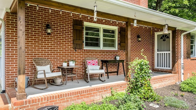 330 Cascade Hollow Rd, Normandy, TN 37360 - view of exterior entry featuring a porch, brick siding, and a chimney
