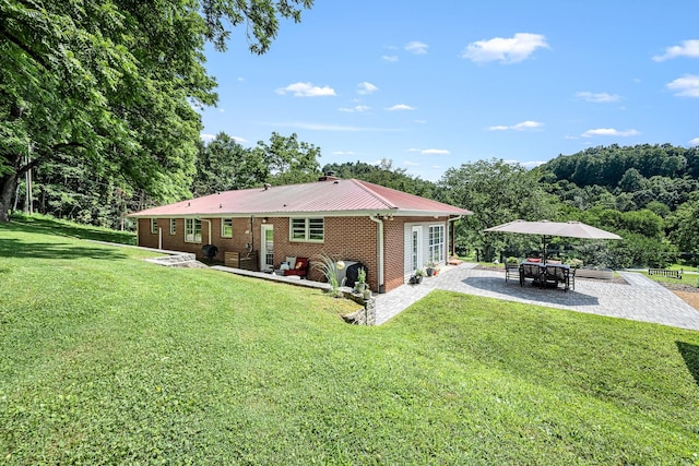 330 Cascade Hollow Rd, Normandy, TN 37360 - back of property with a patio area, brick siding, a yard, and a detached carport