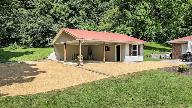 330 Cascade Hollow Rd, Normandy, TN 37360 - view of front of home featuring a patio, a front lawn, a metal roof, an attached carport, and stucco siding