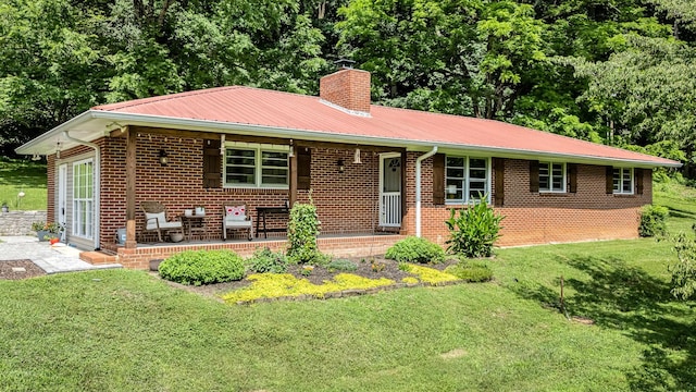 330 Cascade Hollow Rd, Normandy, TN 37360 - ranch-style home with a chimney, a front lawn, covered porch, and brick siding
