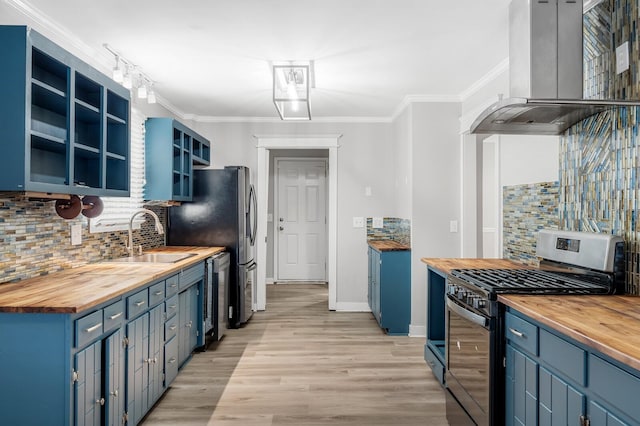 4052 Port Cleburne Ln, Hermitage, TN 37076 - kitchen featuring wooden counters, gas stove, blue cabinets, wall chimney range hood, and crown molding