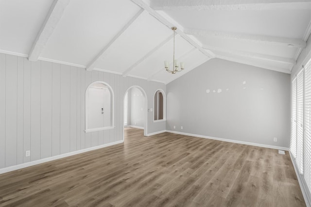 4052 Port Cleburne Ln, Hermitage, TN 37076 - unfurnished living room with a chandelier, wood finished floors, and arched walkways