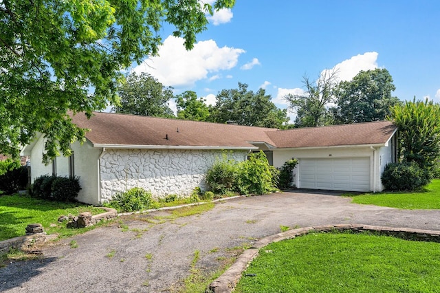 4052 Port Cleburne Ln, Hermitage, TN 37076 - view of front facade with an attached garage, asphalt driveway, and a front yard
