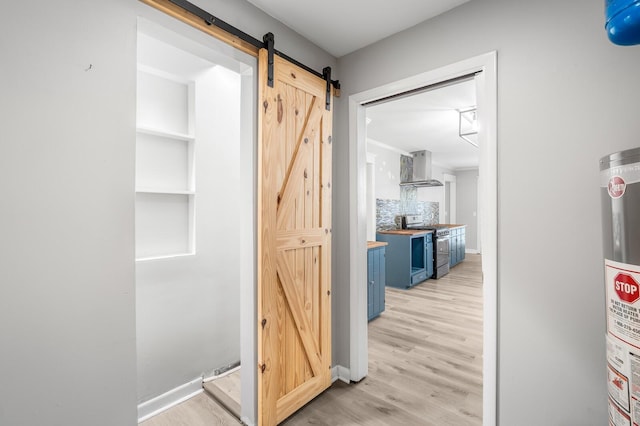 4052 Port Cleburne Ln, Hermitage, TN 37076 - hall with a barn door, light wood-style floors, and gas water heater
