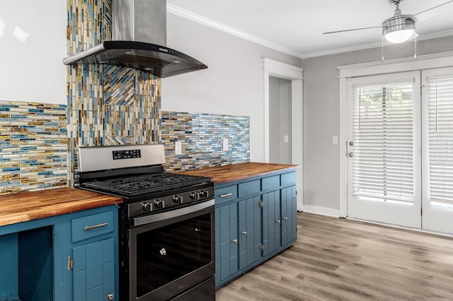 4052 Port Cleburne Ln, Hermitage, TN 37076 - kitchen featuring butcher block countertops, stainless steel range with gas cooktop, island exhaust hood, blue cabinets, and ornamental molding