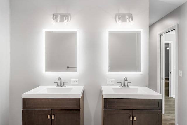 4052 Port Cleburne Ln, Hermitage, TN 37076 - bathroom featuring two vanities and wood finished floors