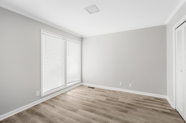 4052 Port Cleburne Ln, Hermitage, TN 37076 - unfurnished bedroom with crown molding, light wood finished floors, and a closet