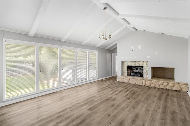 4052 Port Cleburne Ln, Hermitage, TN 37076 - unfurnished living room with wood finished floors, a fireplace, and a chandelier