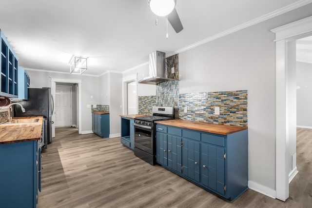4052 Port Cleburne Ln, Hermitage, TN 37076 - kitchen featuring wooden counters, blue cabinets, stainless steel appliances, wall chimney exhaust hood, and open shelves