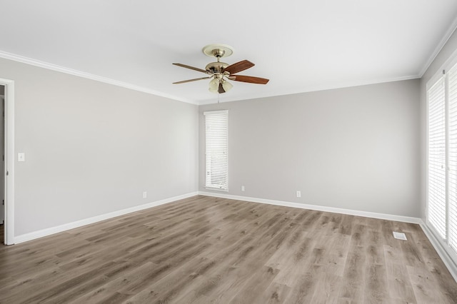 4052 Port Cleburne Ln, Hermitage, TN 37076 - unfurnished room with plenty of natural light, light wood-style flooring, ceiling fan, and crown molding