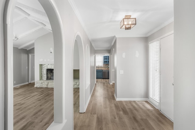 4052 Port Cleburne Ln, Hermitage, TN 37076 - corridor with wood finished floors, ornamental molding, and arched walkways