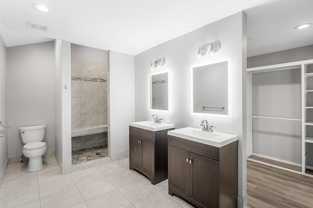 4052 Port Cleburne Ln, Hermitage, TN 37076 - full bath featuring tiled shower, two vanities, recessed lighting, and a closet