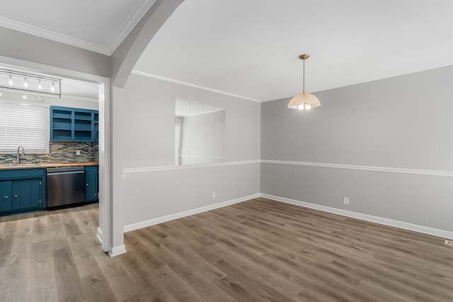 4052 Port Cleburne Ln, Hermitage, TN 37076 - unfurnished dining area with ornamental molding, light wood finished floors, and arched walkways