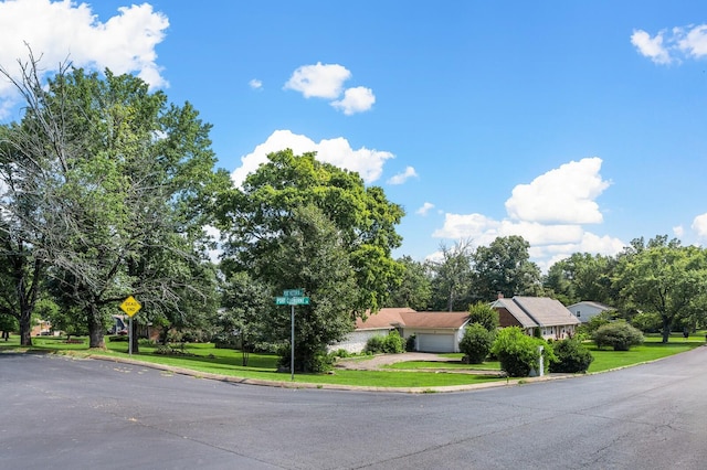 4052 Port Cleburne Ln, Hermitage, TN 37076 - view of asphalt road featuring curbs and traffic signs