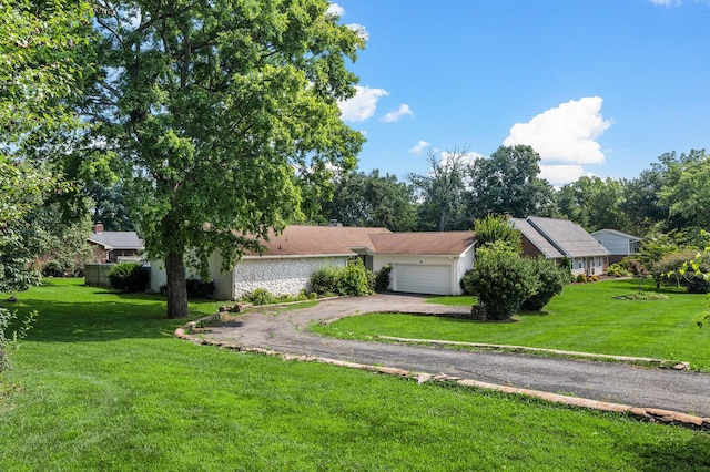 4052 Port Cleburne Ln, Hermitage, TN 37076 - view of front facade with a garage, asphalt driveway, and a front lawn