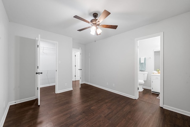 758 Spees Dr, Clarksville, TN 37042 - unfurnished bedroom with a walk in closet, wood finished floors, a closet, and connected bathroom