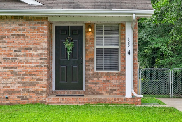 758 Spees Dr, Clarksville, TN 37042 - entrance to property featuring a shingled roof and brick siding