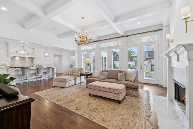 813 Stonewater Blvd, Franklin, TN 37064 - living area with a premium fireplace, beam ceiling, coffered ceiling, crown molding, and a chandelier
