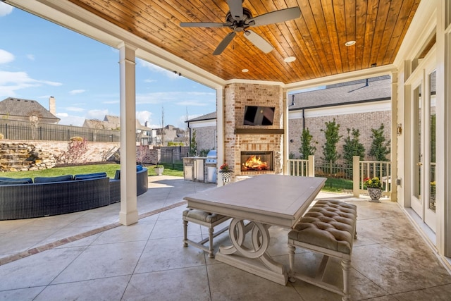 813 Stonewater Blvd, Franklin, TN 37064 - view of patio with an outdoor living space with a fireplace, a ceiling fan, grilling area, and a residential view