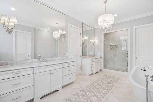 813 Stonewater Blvd, Franklin, TN 37064 - full bath featuring a chandelier, a stall shower, two vanities, a freestanding bath, and ornamental molding