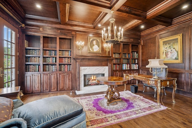 813 Stonewater Blvd, Franklin, TN 37064 - living area with wooden walls, built in features, crown molding, a wooden ceiling with exposed beams, and a fireplace