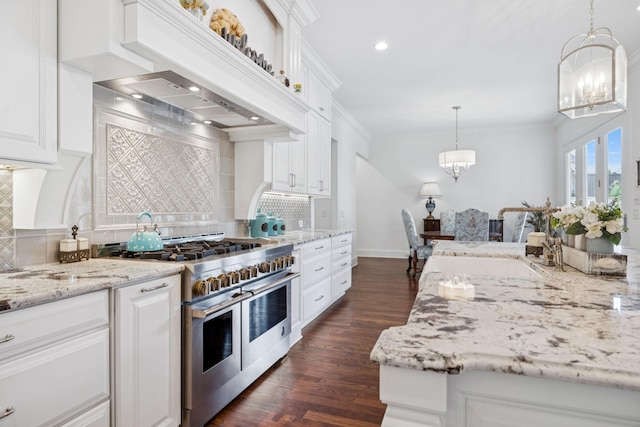 813 Stonewater Blvd, Franklin, TN 37064 - kitchen featuring range with two ovens, a chandelier, dark wood-style floors, backsplash, and ornamental molding