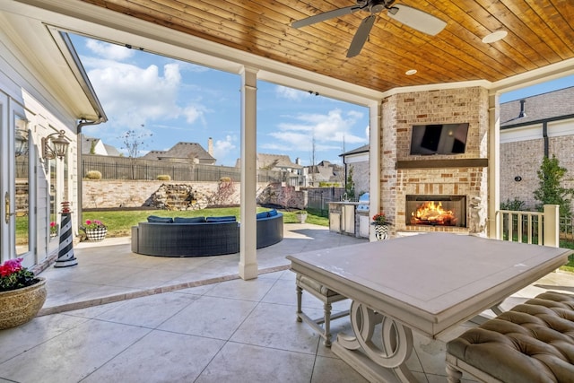 813 Stonewater Blvd, Franklin, TN 37064 - view of patio / terrace with an outdoor living space with a fireplace, a ceiling fan, and a residential view