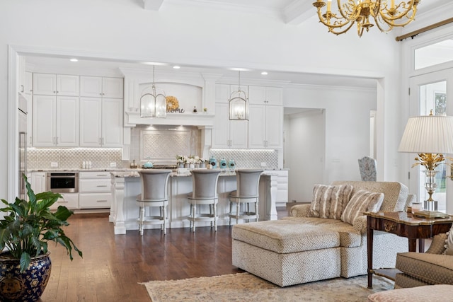 813 Stonewater Blvd, Franklin, TN 37064 - living area with a chandelier, dark wood finished floors, crown molding, and recessed lighting