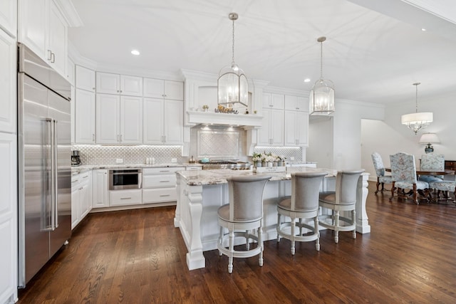 813 Stonewater Blvd, Franklin, TN 37064 - kitchen featuring built in refrigerator, decorative backsplash, white cabinets, recessed lighting, and dark wood finished floors