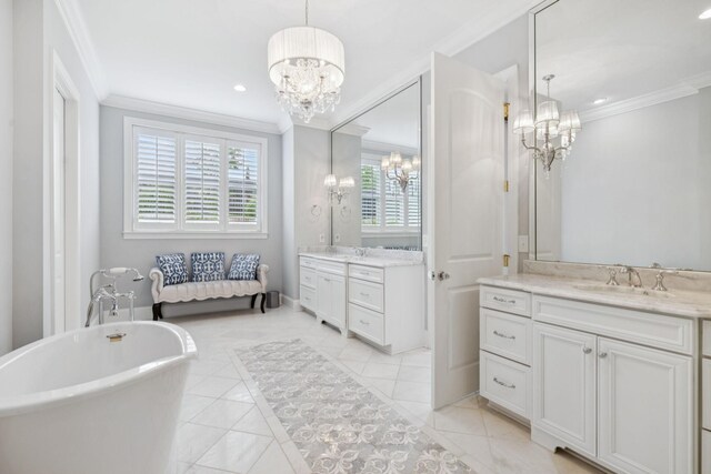 813 Stonewater Blvd, Franklin, TN 37064 - full bathroom featuring a chandelier, crown molding, two vanities, a freestanding tub, and tile patterned floors