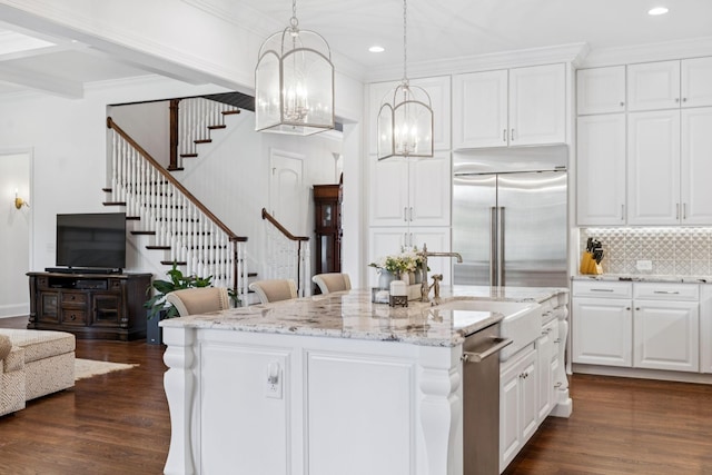 813 Stonewater Blvd, Franklin, TN 37064 - kitchen featuring appliances with stainless steel finishes, dark wood-style floors, open floor plan, recessed lighting, and crown molding