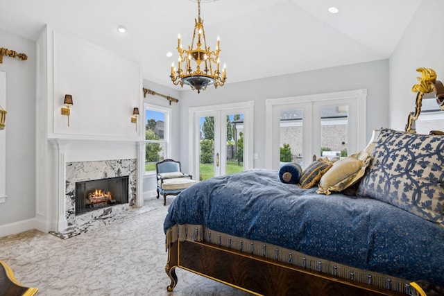 813 Stonewater Blvd, Franklin, TN 37064 - bedroom with french doors, access to exterior, a chandelier, a high end fireplace, and carpet floors