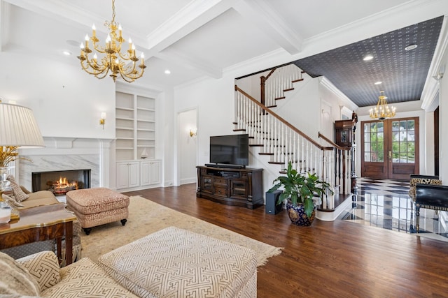 813 Stonewater Blvd, Franklin, TN 37064 - living area featuring a chandelier, crown molding, stairway, wood finished floors, and built in features