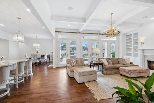 813 Stonewater Blvd, Franklin, TN 37064 - living area featuring dark wood-style floors, a chandelier, crown molding, beamed ceiling, and a fireplace