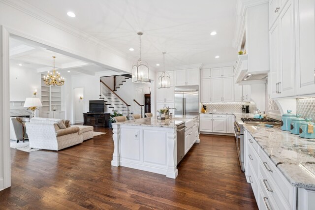 813 Stonewater Blvd, Franklin, TN 37064 - kitchen with high quality appliances, open floor plan, recessed lighting, white cabinets, and tasteful backsplash