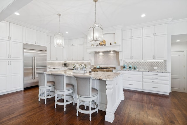 813 Stonewater Blvd, Franklin, TN 37064 - kitchen featuring stainless steel built in fridge, tasteful backsplash, white cabinets, light stone counters, and recessed lighting