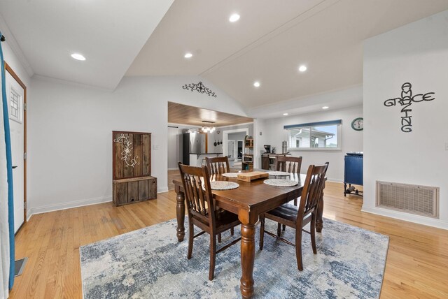 779 Dogwood Dr, Erin, TN 37061 - dining room with light wood-style flooring, lofted ceiling, and recessed lighting