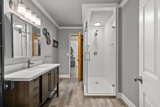 779 Dogwood Dr, Erin, TN 37061 - full bathroom with a shower stall, vanity, wood finished floors, and crown molding
