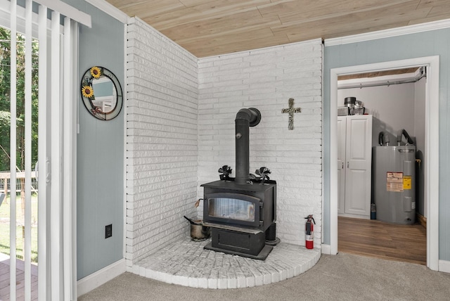 779 Dogwood Dr, Erin, TN 37061 - detailed view of electric water heater, a wood stove, carpet flooring, wooden ceiling, and crown molding