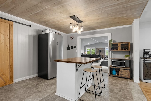 779 Dogwood Dr, Erin, TN 37061 - kitchen with appliances with stainless steel finishes, wood counters, ornamental molding, wooden ceiling, and a breakfast bar