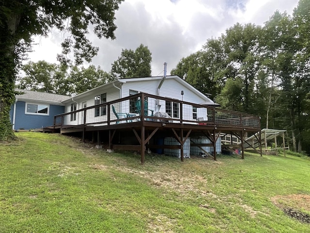 779 Dogwood Dr, Erin, TN 37061 - back of property with a lawn and a wooden deck