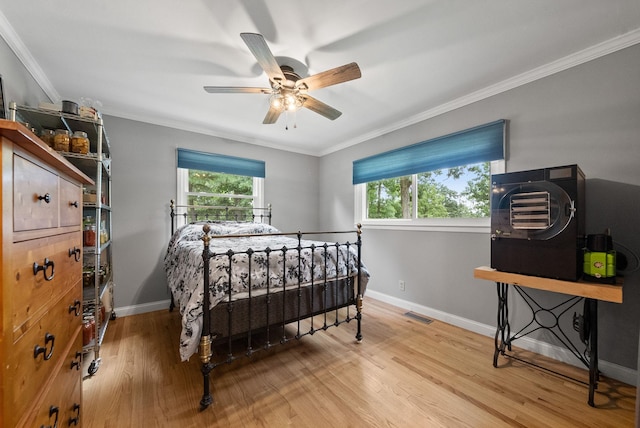 779 Dogwood Dr, Erin, TN 37061 - bedroom with wood finished floors, crown molding, and ceiling fan