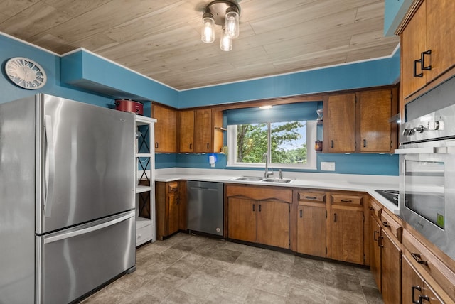 779 Dogwood Dr, Erin, TN 37061 - kitchen with stainless steel appliances, brown cabinetry, wood ceiling, and light countertops