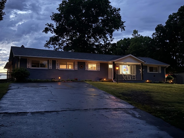 779 Dogwood Dr, Erin, TN 37061 - single story home featuring covered porch, a front yard, and driveway