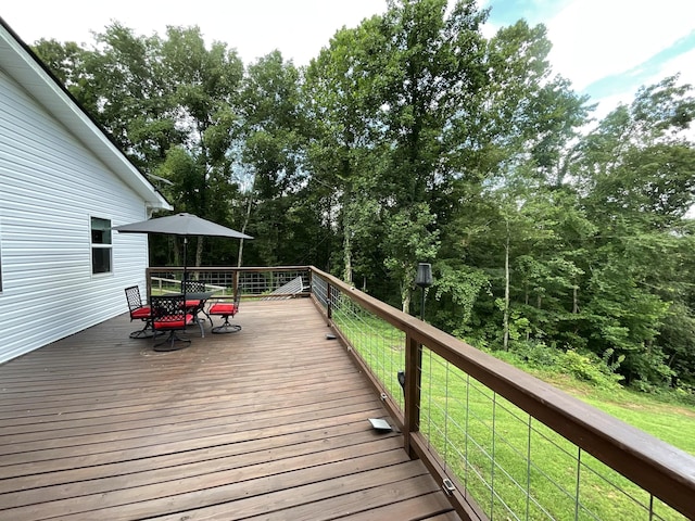 779 Dogwood Dr, Erin, TN 37061 - wooden terrace featuring outdoor dining area and a lawn