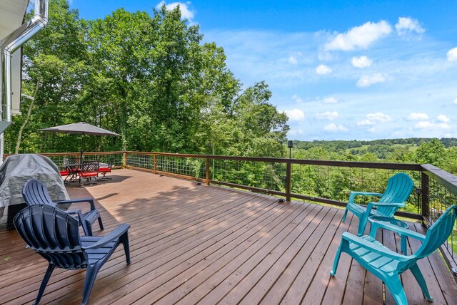 779 Dogwood Dr, Erin, TN 37061 - wooden terrace with outdoor dining space