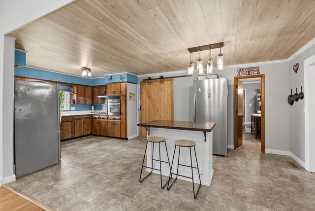 779 Dogwood Dr, Erin, TN 37061 - kitchen with appliances with stainless steel finishes, a barn door, brown cabinetry, wooden ceiling, and a breakfast bar