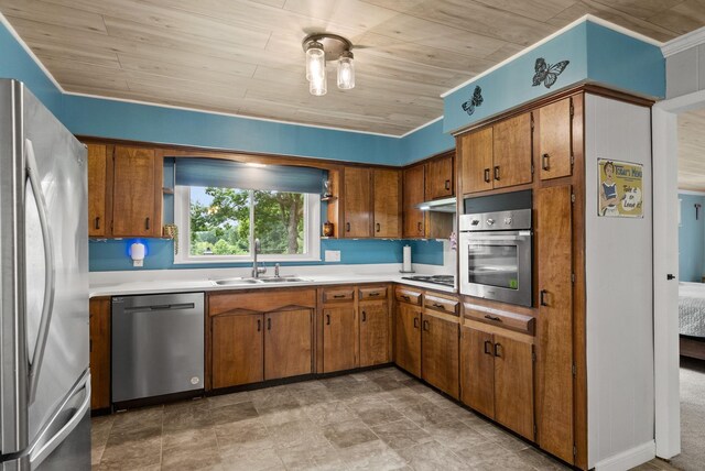 779 Dogwood Dr, Erin, TN 37061 - kitchen with stainless steel appliances, brown cabinets, light countertops, and wooden ceiling