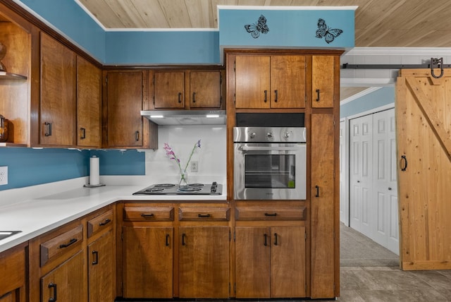 779 Dogwood Dr, Erin, TN 37061 - kitchen with stainless steel oven, electric cooktop, wooden ceiling, under cabinet range hood, and light countertops